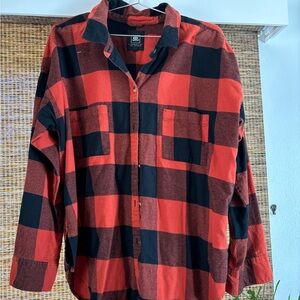 Rip curl flannel . Orange and black . Good condition.